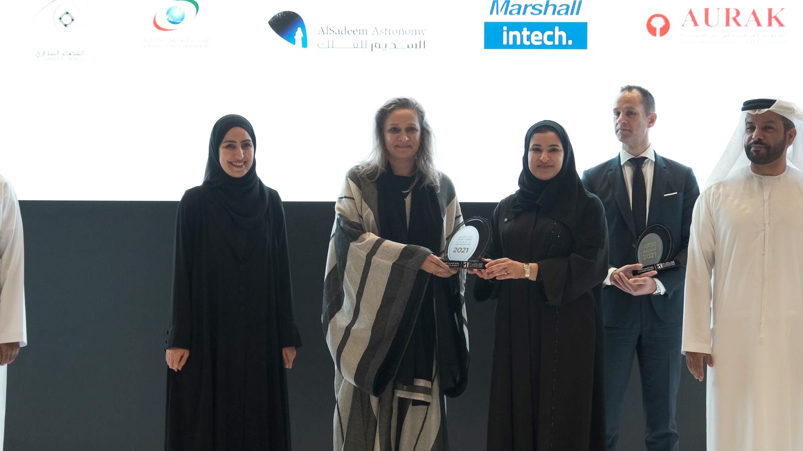 Her Excellency Sarah Al Amiri presenting Orbital Space's Nada Alshammari with a 2021 industry award