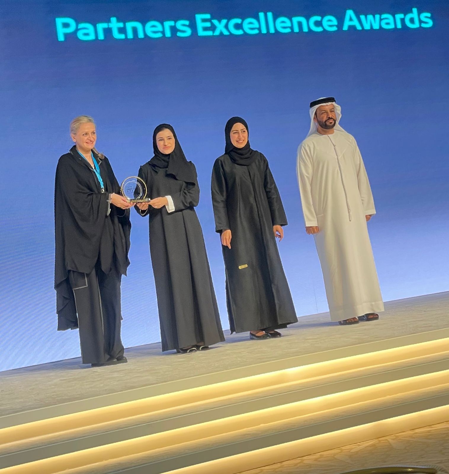 Her Excellency Sarah Al Amiri presenting Nada Alshammari with the Partners Excellence Award, 2022